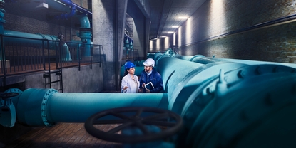 Engineers in front of a water distribution network